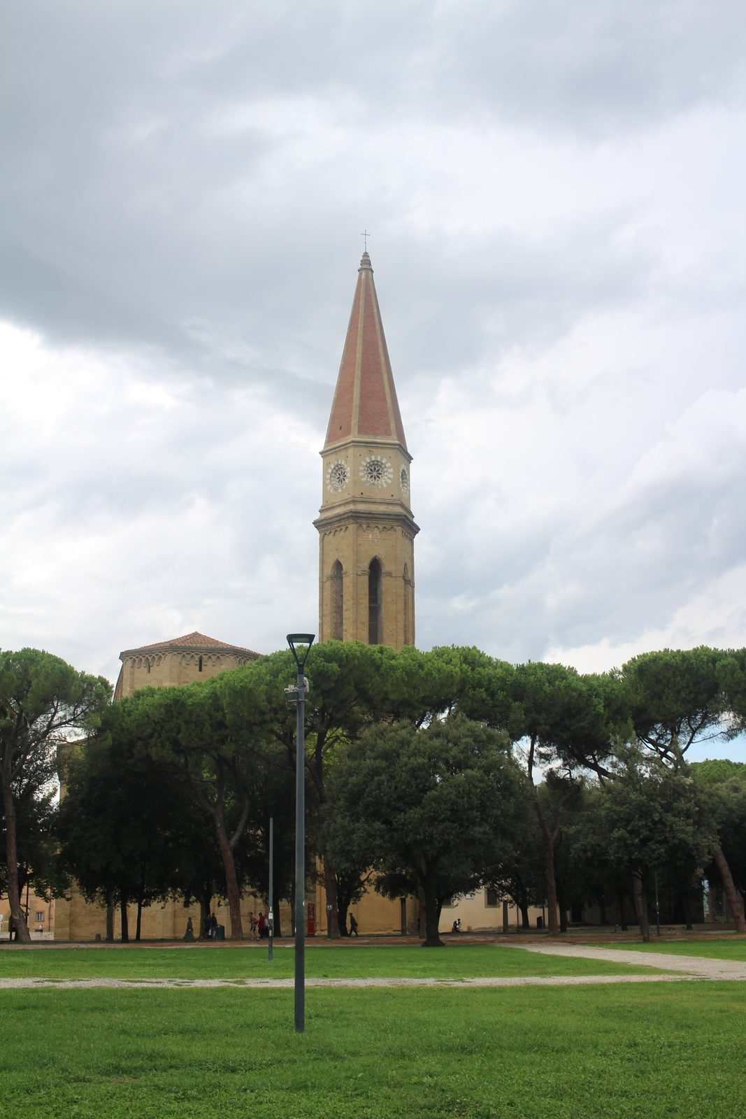 Bell tower rising over a park in Arezzo, Tuscany