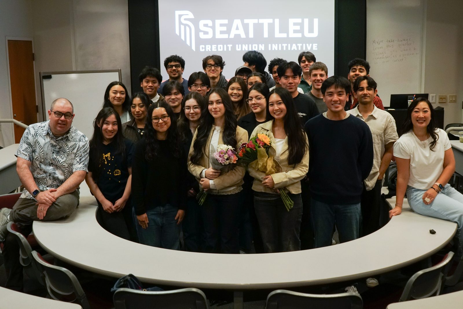 SUCUI members gathered around a table on campus
